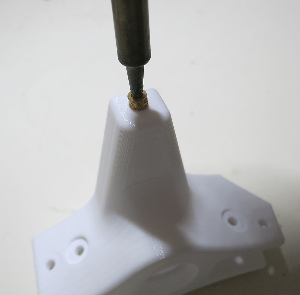 Rocker heat set insert