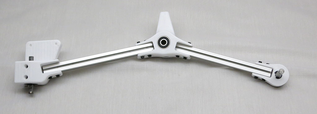 Rocker link to front wheel