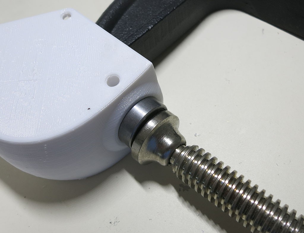 Steering knuckle bearing installed with clamp